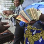 Zimbabwe unveils new currency as depreciation, inflation stoke turmoil